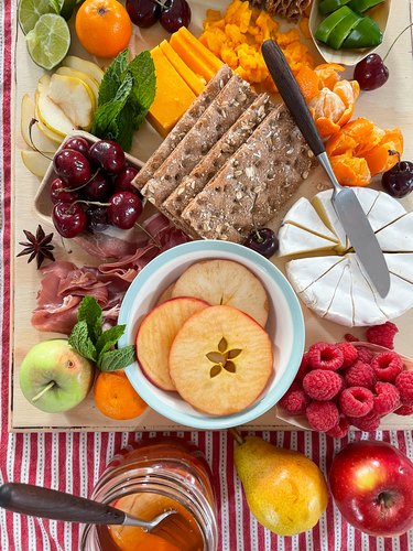 finished pickled apples on a charcuterie board