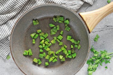 Cook diced bell peppers