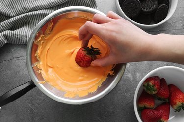 Dip the strawberries