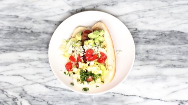 Cobb salad ingredients on top of hot dog