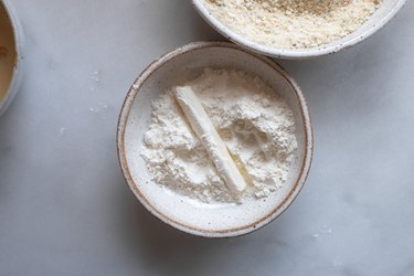 Coat the mozzarella in the flour followed by the egg mixture and then the bread crumb mixture.