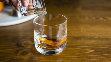 Pouring the simple syrup into the glass