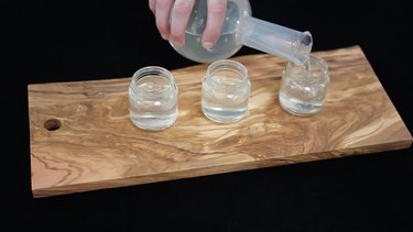 Pouring gelatin mixture into baby food jars