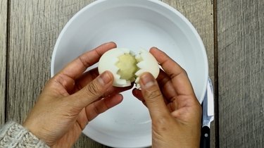 Removing yolks for deviled egg Easter chicks.