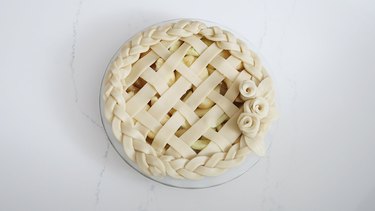 Pie decorated with lattice, braids and roses