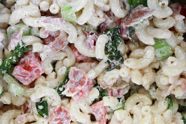 Add tomatoes to the macaroni salad