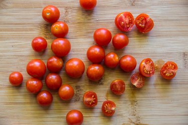 Cherry tomatoes on a cutting board