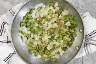 Cook peppers and onions