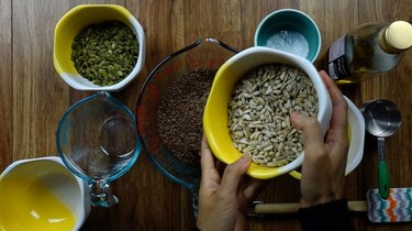 Adding sunflower seeds ingredients for Nordic Stone Age Nut Bread