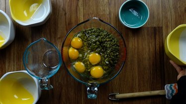 Adding eggs to ingredients for Nordic Stone Age Nut Bread