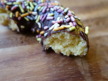 Healthy coconut flour low carb chocolate covered donut with sprinkles.