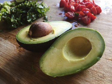 avocado with tomato and cilantro ingredients chopped