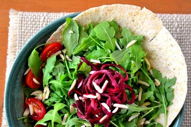 salad of leafy greens, beats, and tomatoes