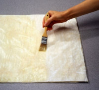 Brush phyllo sheets with butter when making strudel roll.