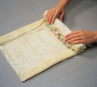 Fold long sides of phyllo over the filling when making pastry dough.