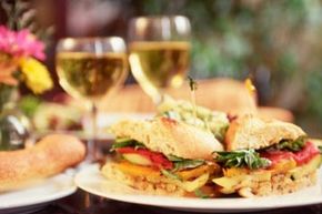 This roasted vegetable sandwich is complemented by a vegan white wine.